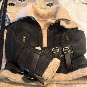 CC Studios aviation shearling and leather jacket with buckle details.